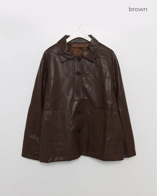 Two-tone leather jacket with contrasting sleeves.