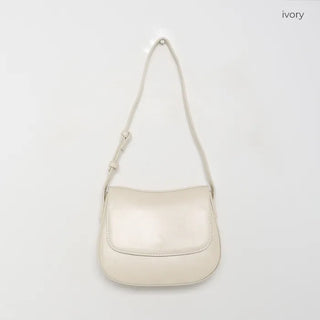 Round flap shoulder bag