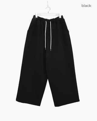 Fleece-lined one-pleat sweatpants