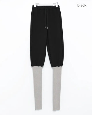 Open-heel ribbed knee-high socks layered pants