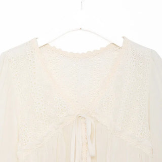Punched open ribbon blouse