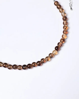 Clear brown ball necklace