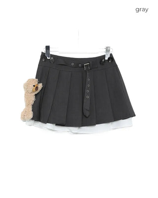Animal brooch set with very short pleated skirt