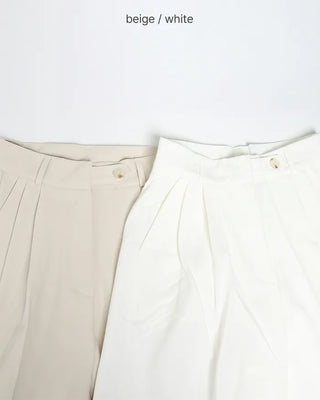High-waisted, two-pleat, button-down wide-leg trousers
