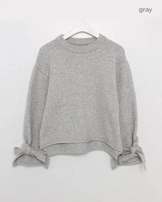 Knit sweater with ribbon detail on the sleeves