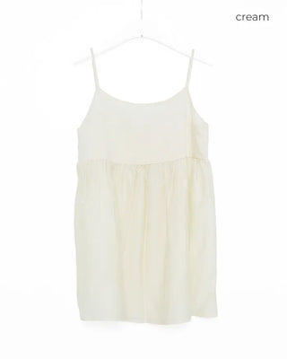 Back-button sleeveless blouse