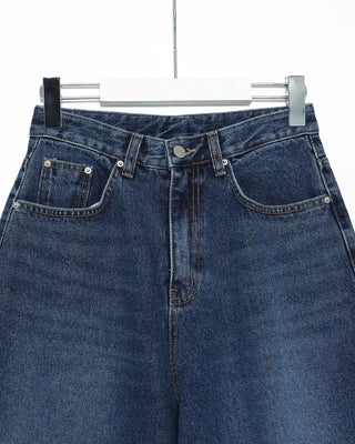 Wide-leg jeans with faded whisker wash.