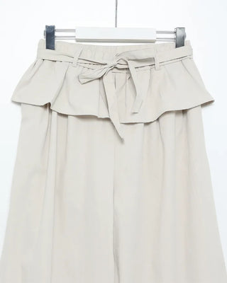 Wide-leg pants with pleats and peplum belt