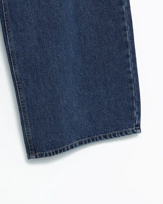 Wide-leg jeans with faded whisker wash.