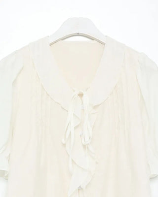 Pintuck ruffle bow tie blouse
