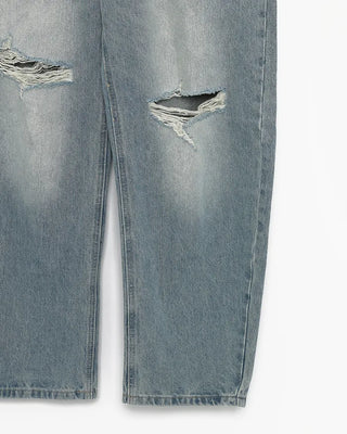 Knee-damaged vintage denim pants