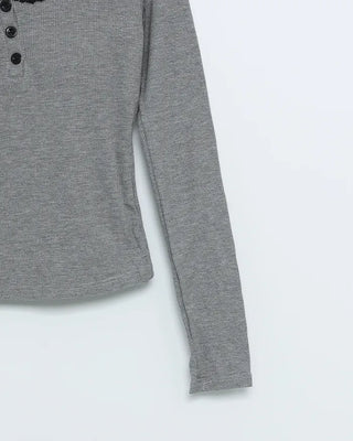 Long-sleeved T-shirt with neck lace detail and buttons