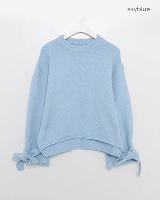 Knit sweater with ribbon detail on the sleeves