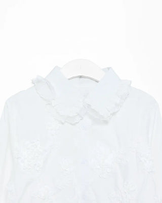 Flower embroidered peplum blouse