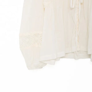 Punched open ribbon blouse