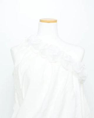 Asymmetrical ruffled sleeveless blouse