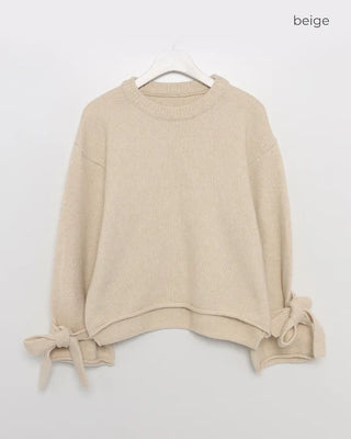 Knit sweater with ribbon detail on the sleeves