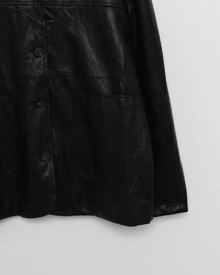 Two-tone leather jacket with contrasting sleeves.