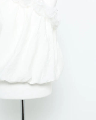 Asymmetrical ruffled sleeveless blouse