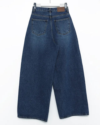 Wide-leg jeans with faded whisker wash.