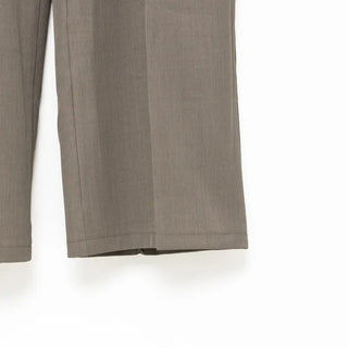 Belted pleated slacks
