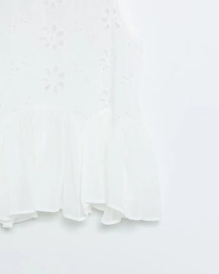 Perforated ruffle sleeveless top