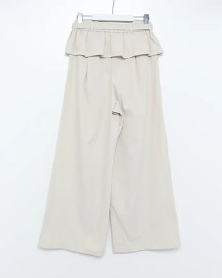 Wide-leg pants with pleats and peplum belt