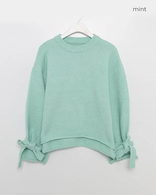 Knit sweater with ribbon detail on the sleeves
