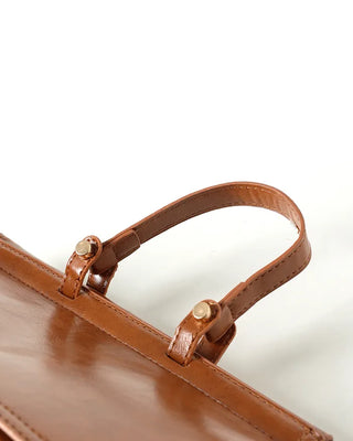 Gold button shoulder bag