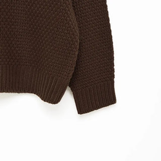 Round punched knit sweater