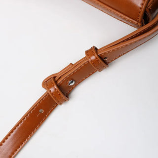Round flap shoulder bag