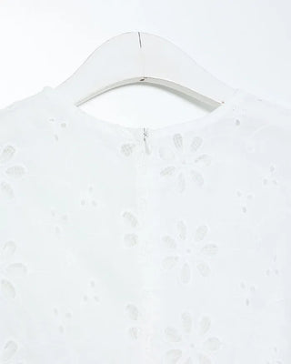 Perforated ruffle sleeveless top