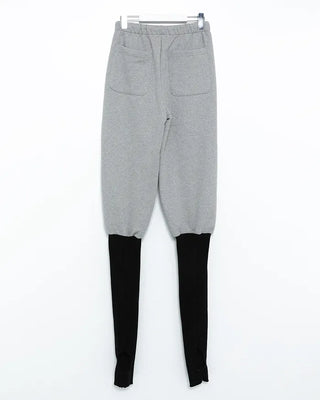 Open-heel ribbed knee-high socks layered pants