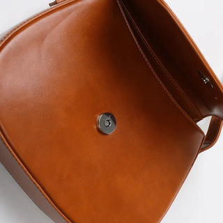 Round flap shoulder bag