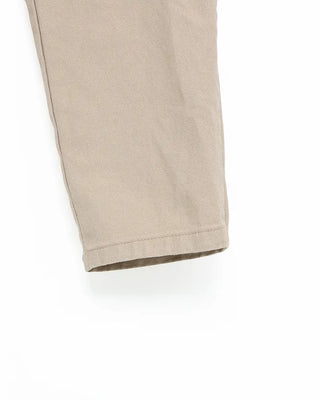 Side-tucked white cotton pants
