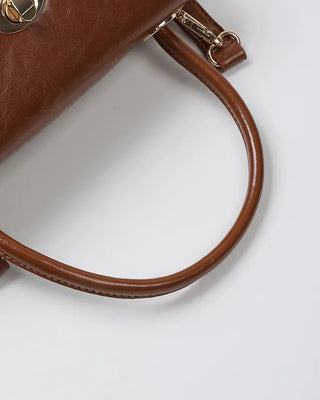 One-button leather handbag