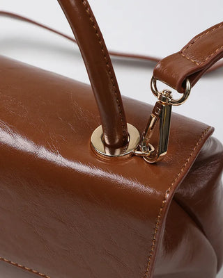 One-button leather handbag