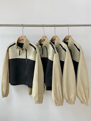 Asymmetric windbreaker jacket