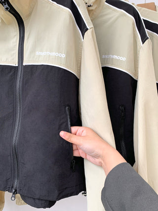 Asymmetric windbreaker jacket