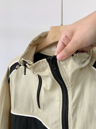 Asymmetric windbreaker jacket