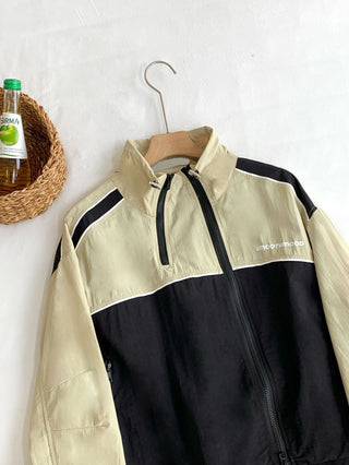 Asymmetric windbreaker jacket