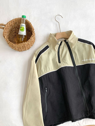 Asymmetric windbreaker jacket