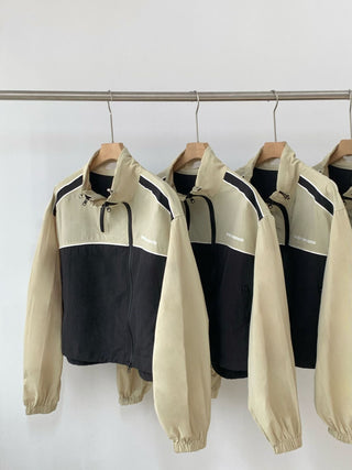Asymmetric windbreaker jacket