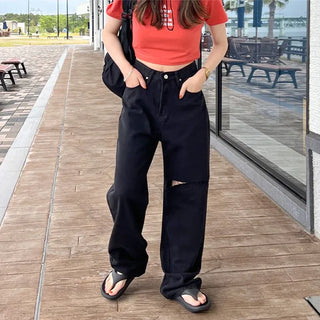 Distressed black denim pants