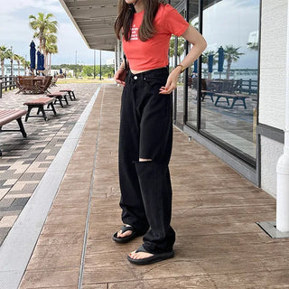 Distressed black denim pants
