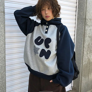 Fish patch and contrast button hoodie