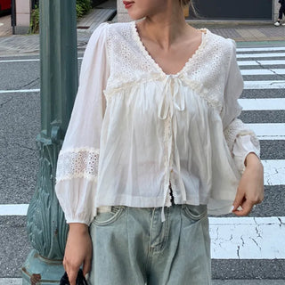 Punched open ribbon blouse