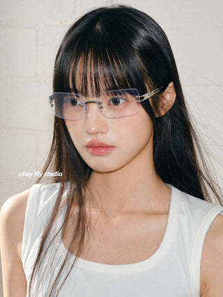 silver frameless glasses