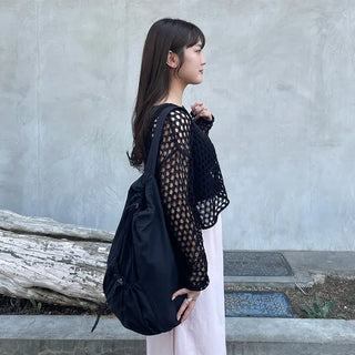 Drawstring pocket shoulder bag