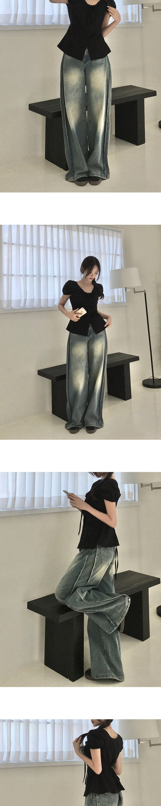 Washed wide-leg pants with side pleats